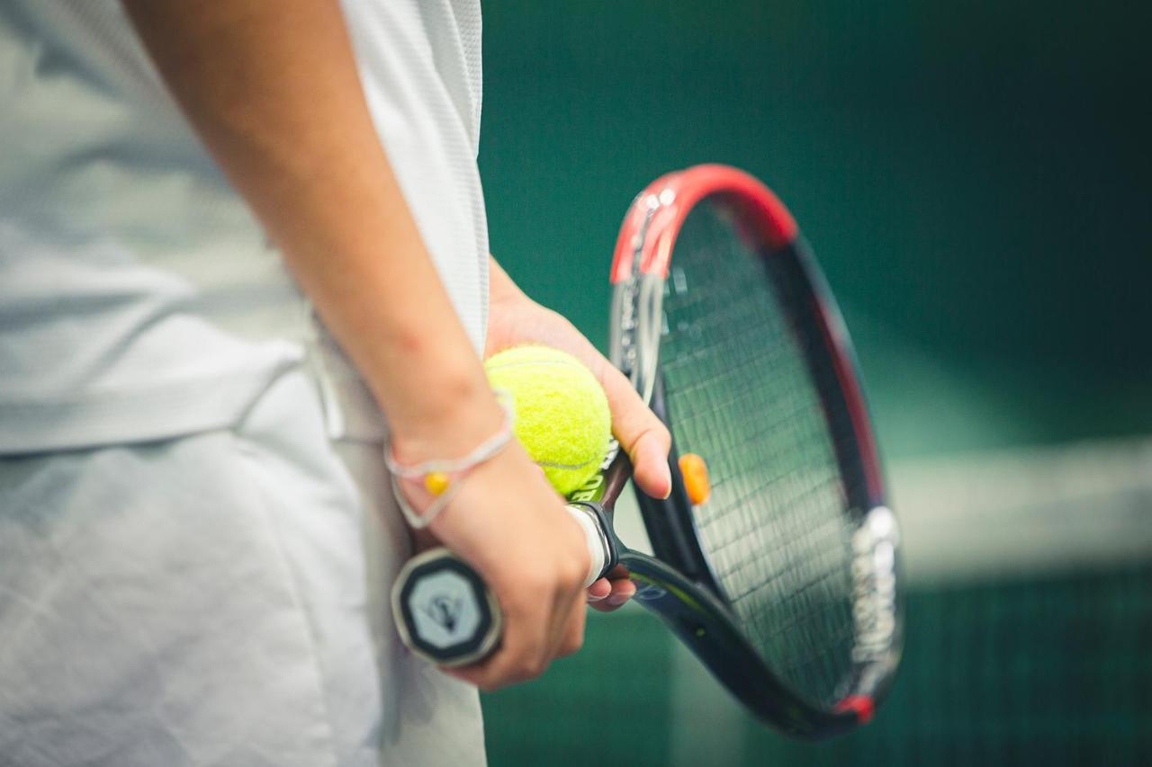 The Oceanic Sportel Phuket - Sha Extra Plus Exterior photo Tennis player holding a racket